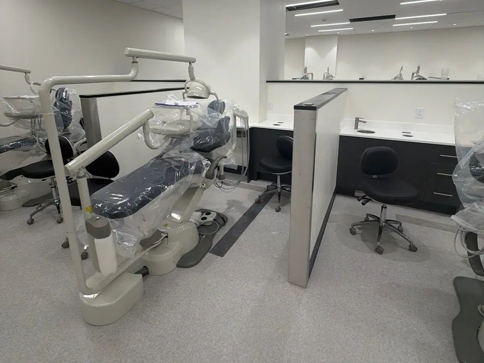 Dental operatory with a new chair and cabinetry after the final clean